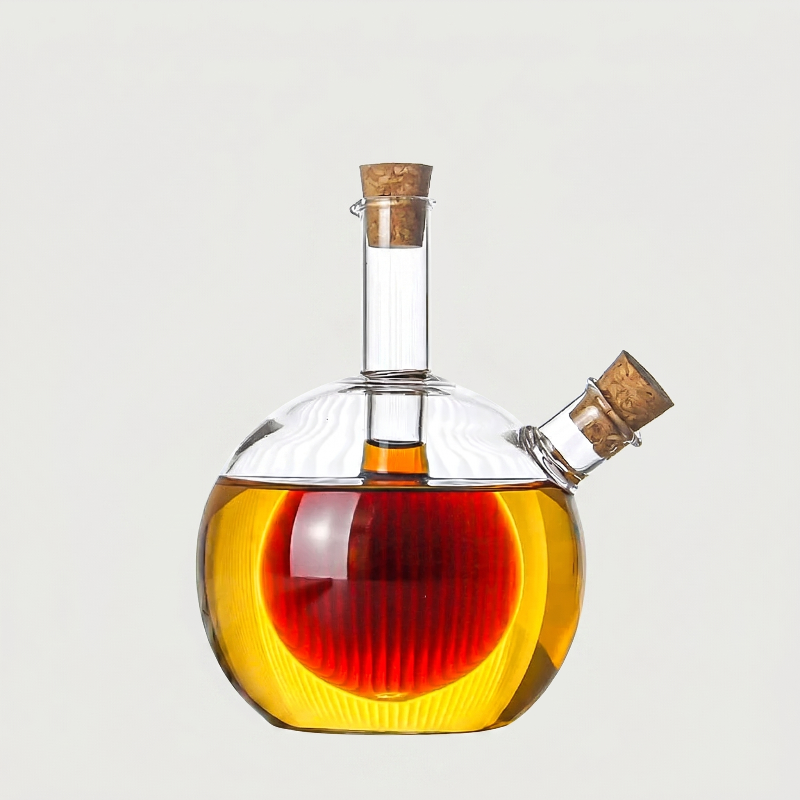 Round dual oil and vinegar bottle on white background with side spout