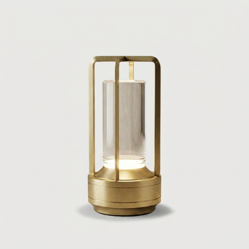 Gold Elio cordless metal table lamp on white background