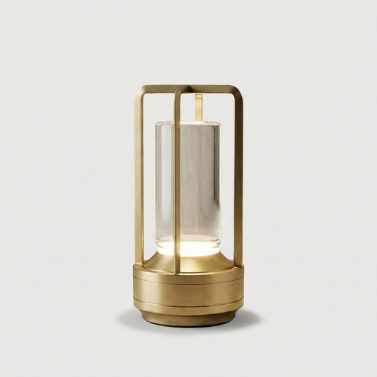 Gold Elio cordless metal table lamp on white background