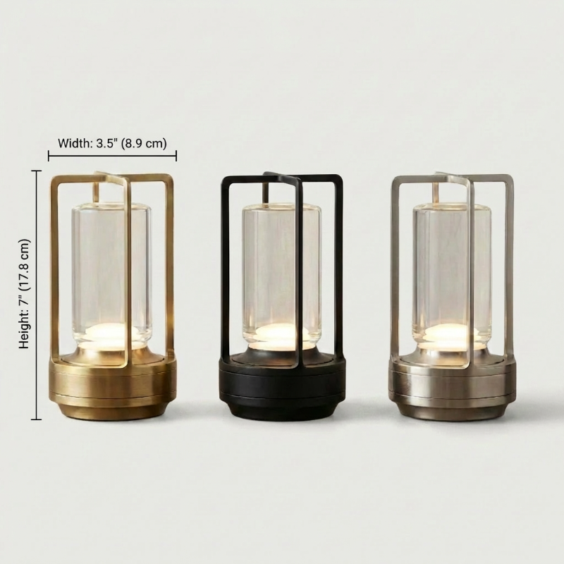 Elio cordless metal table lamps in gold, black, and silver on white background