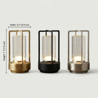 Elio cordless metal table lamps in gold, black, and silver on white background
