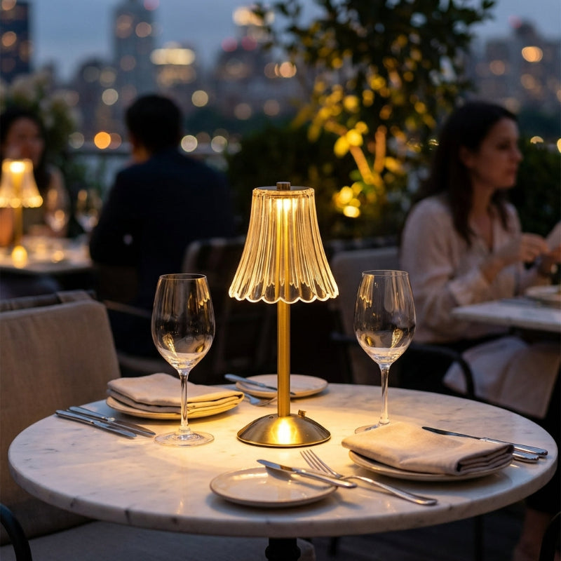 Elysian cordless dimmable table lamp on restaurant table at night