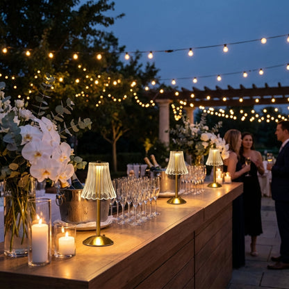 Elysian cordless dimmable table lamp on outdoor dining table with string lights