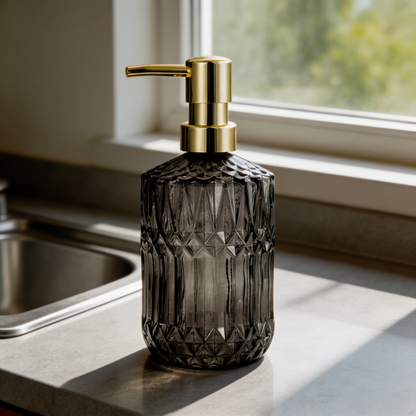 Smoke facet glass soap dispenser on sink ledge