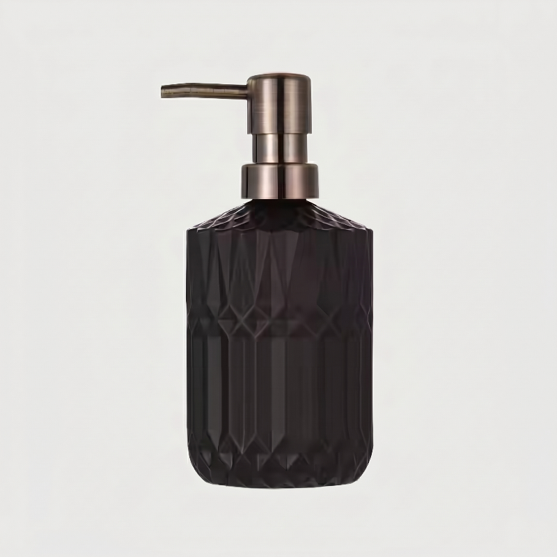 Black facet glass soap dispenser on white background