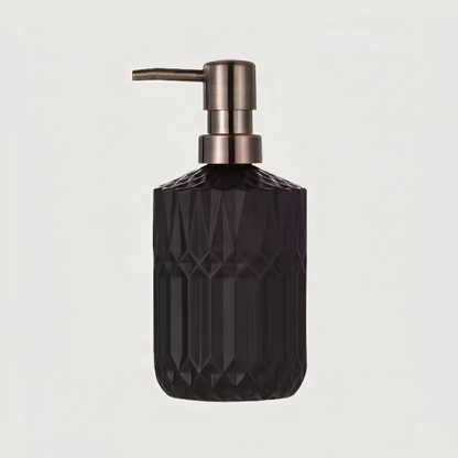 Black facet glass soap dispenser on white background