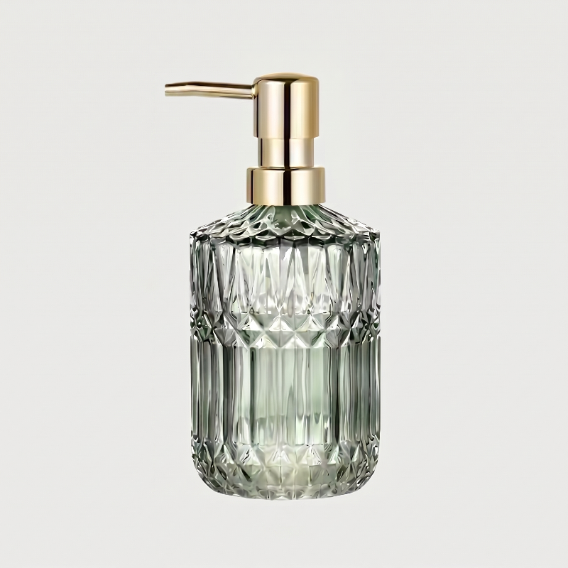 Green facet glass soap dispenser on white background