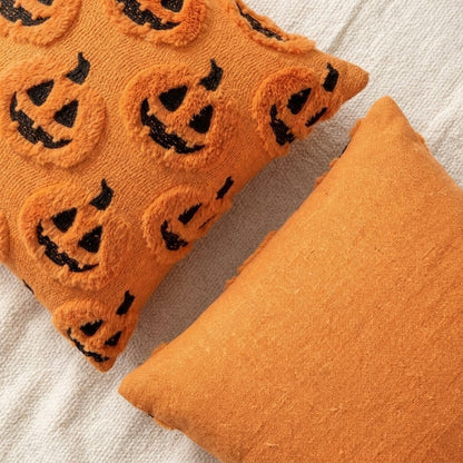 Close-up of the Pumpkins Fall Halloween Throw Pillow Cover showing the embroidered front and solid orange back