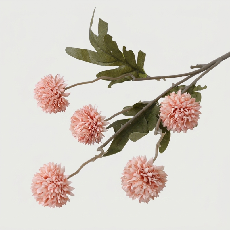 Pink faux dandelion stems on white background
