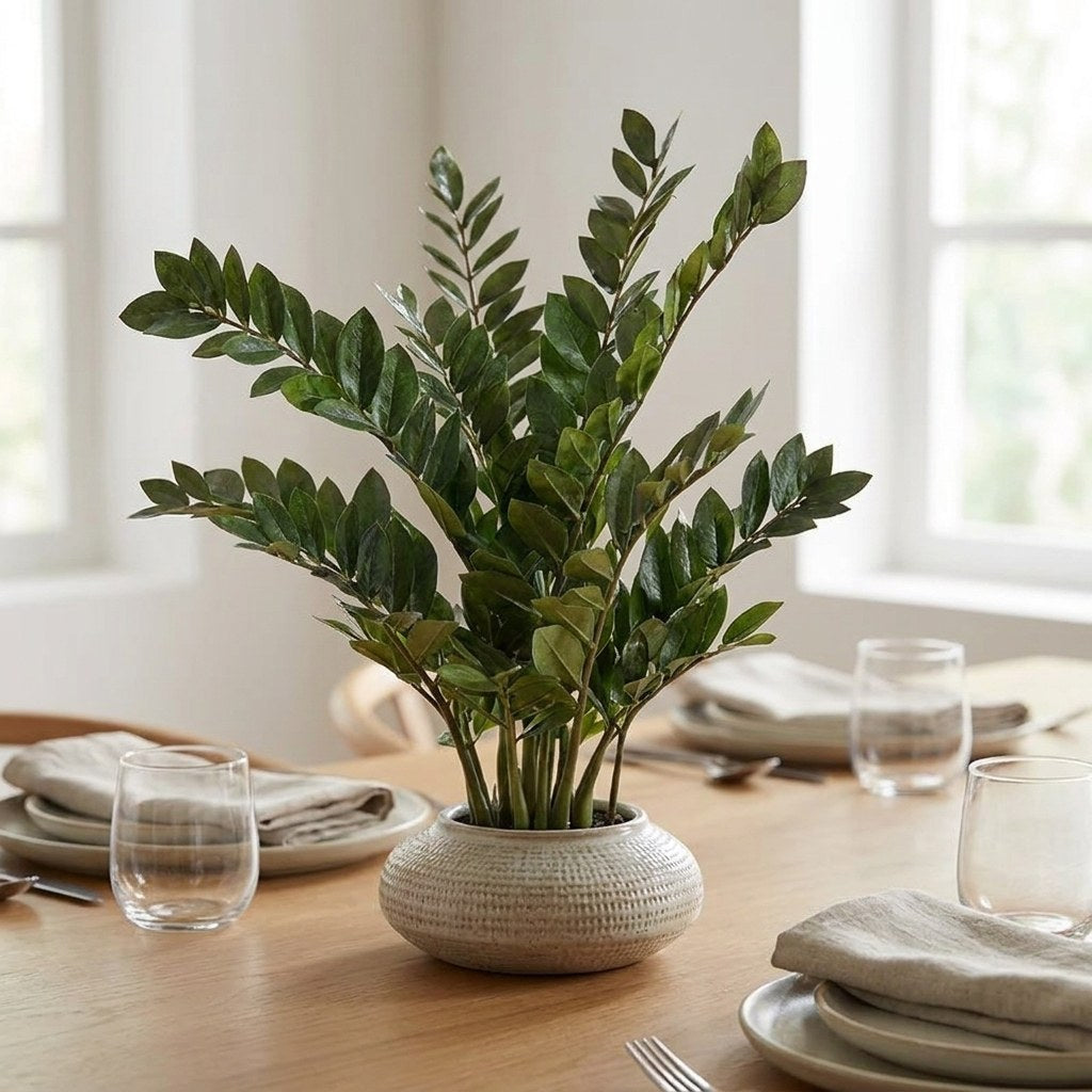 Faux ficus branch stems in a ribbed vase on a dining table, Kiyo Home
