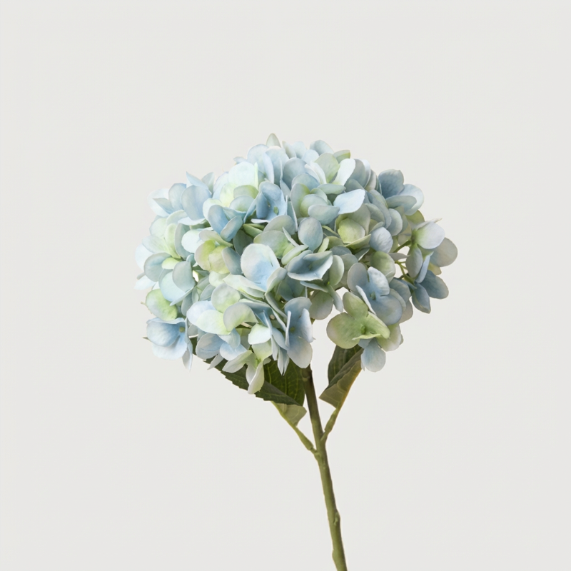 Blue faux hydrangea stem on white background