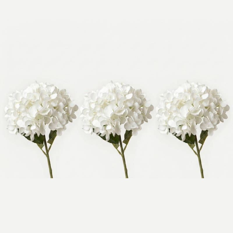 Three white faux hydrangea stems on white background