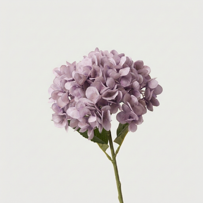 Purple faux hydrangea stem on white background