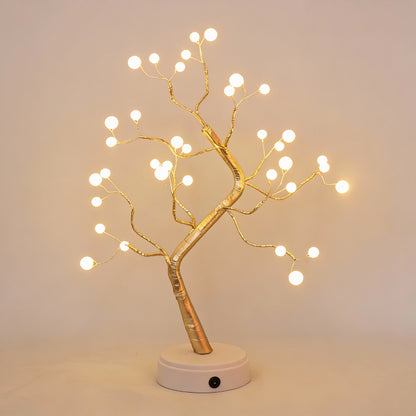 Decorative light tree with illuminated branches on a plain background