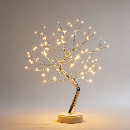 Decorative LED tree with lights on a gray background