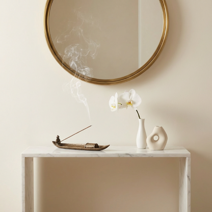 Fishing boat incense burner styled on console table with mirror