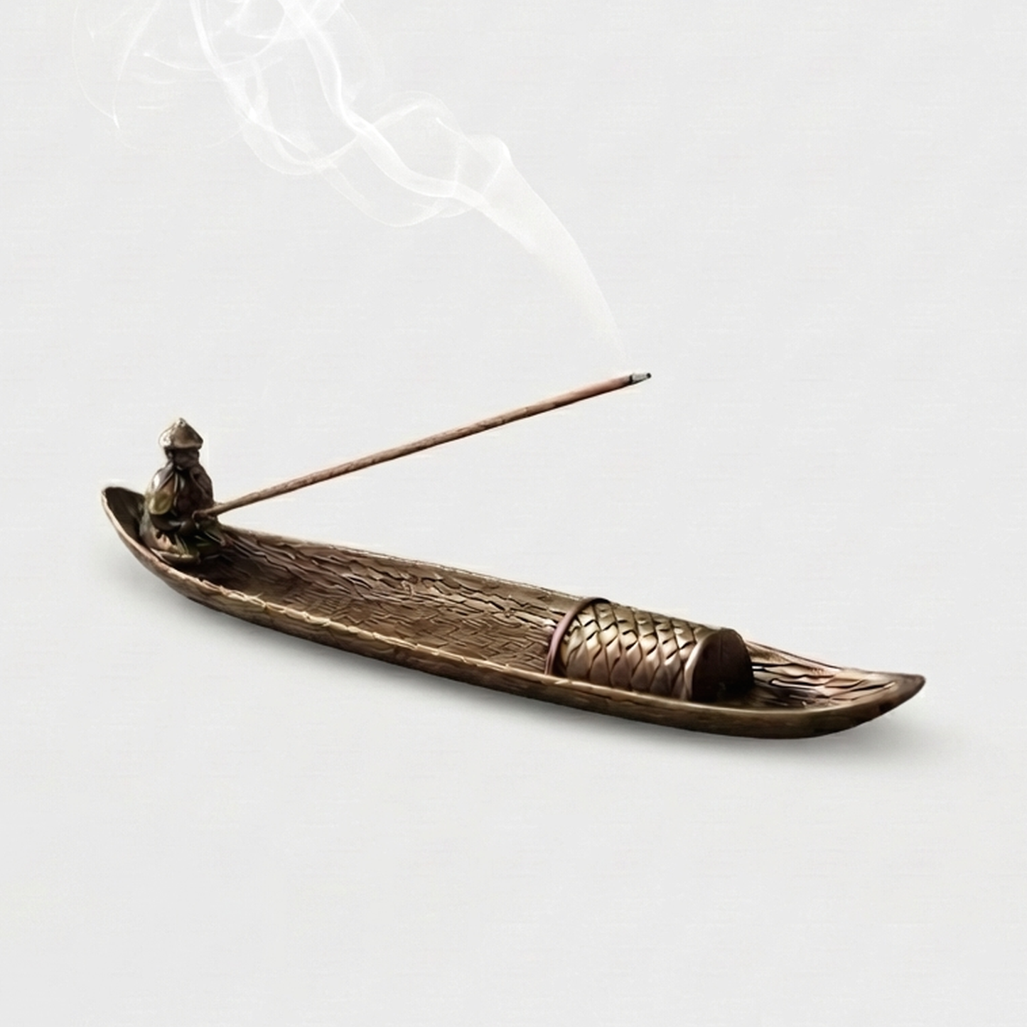 Fishing boat incense burner on white background with incense stick