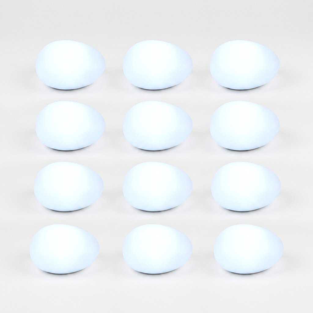 Twelve frosted solar glass pebble lights glowing cool white in a grid of three by four on a light background