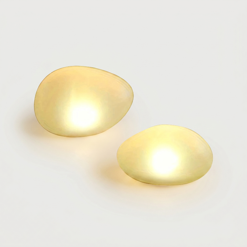 Warm white frosted solar glass pebble lights on white background