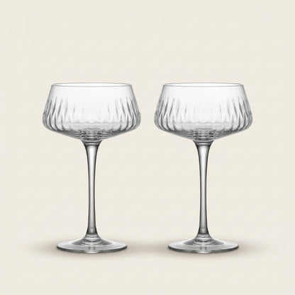 Garden coupe glass with cocktail on table