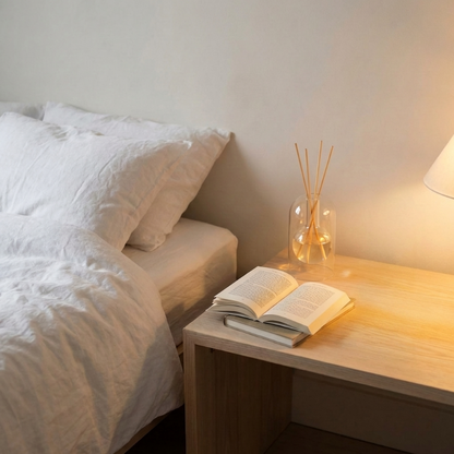 Clear glass reed diffuser for non-toxic bedroom aromatherapy.