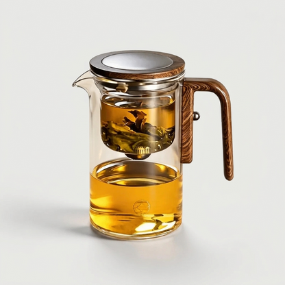 Glass tea infuser teapot on white background