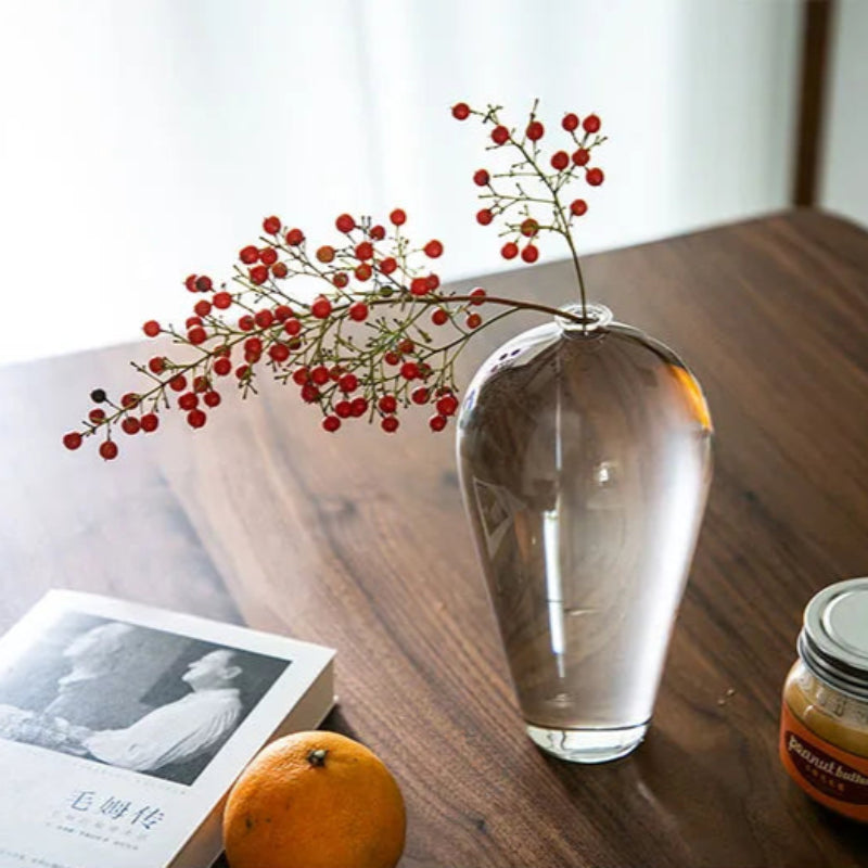 lear glass vase styled with fresh white flowers on a modern wooden table, perfect for home decor.