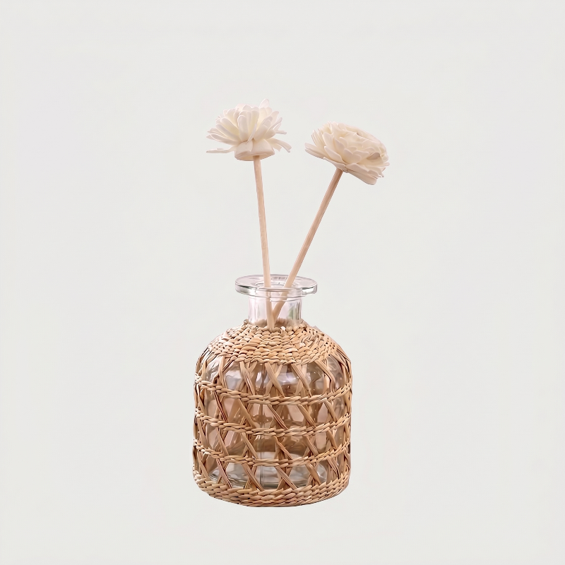 Glass vase with woven rattan on white background