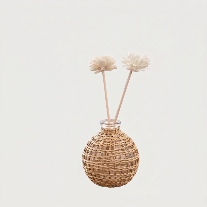 Glass vase with woven rattan on white background