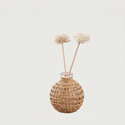 Glass vase with woven rattan on white background