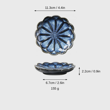 Dimensions graphic of a cobalt blue glazed scalloped ceramic dish in top and side views, labeled 11.3cm / 4.4in wide, 2.2cm / 0.9in high, 6.7cm / 2.6in base and 155 g