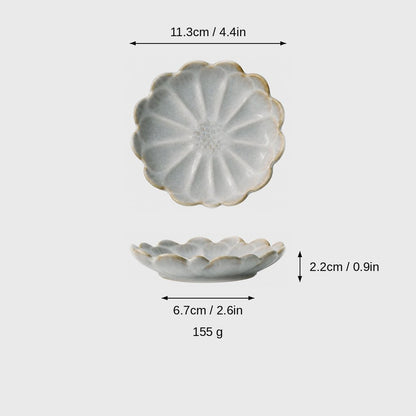 Dimensions graphic of a pale gray-beige crackle-glaze scalloped ceramic dish in top and side views, labeled 11.3cm / 4.4in wide, 2.2cm / 0.9in high, 6.7cm / 2.6in base and 155 g