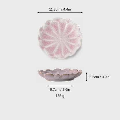 Dimensions graphic of a pink glazed scalloped ceramic dish in top and side views, labeled 11.3cm / 4.4in wide, 2.2cm / 0.9in high, 6.7cm / 2.6in base and 155 g