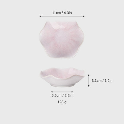 Dimensions graphic of a pale pink glazed ceramic dish with a wavy rim in top and side views, labeled 11cm / 4.3in wide, 3.1cm / 1.2in high, 5.5cm / 2.2in base and 123 g