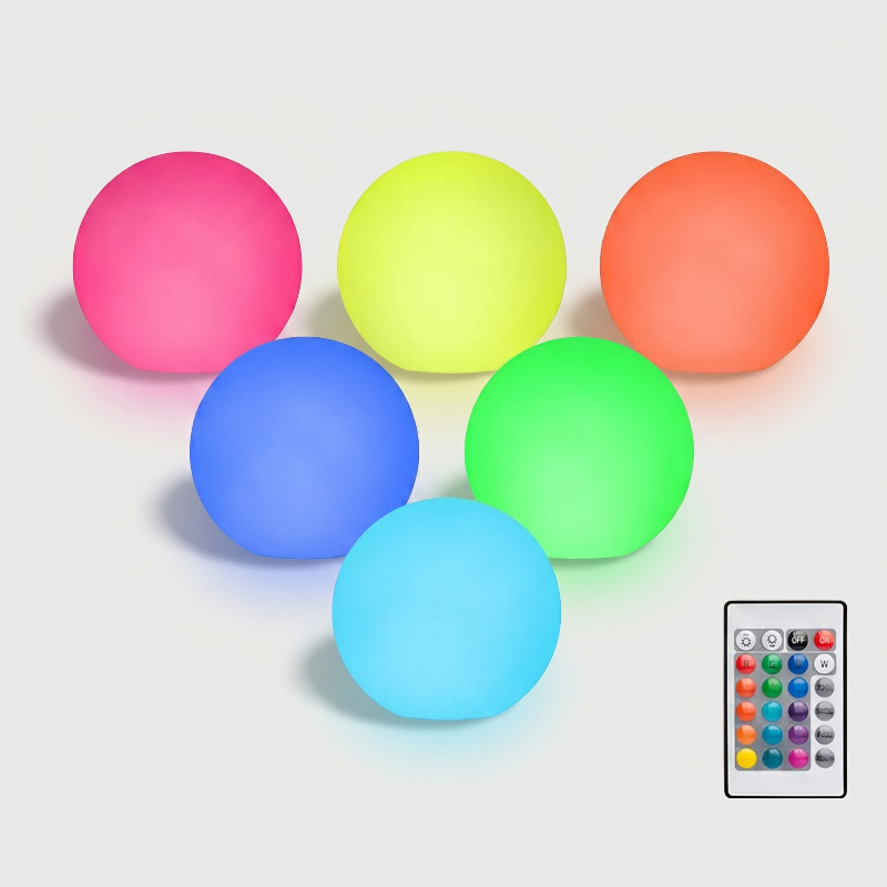 Set of multicolor globe accent lights on white background with remote