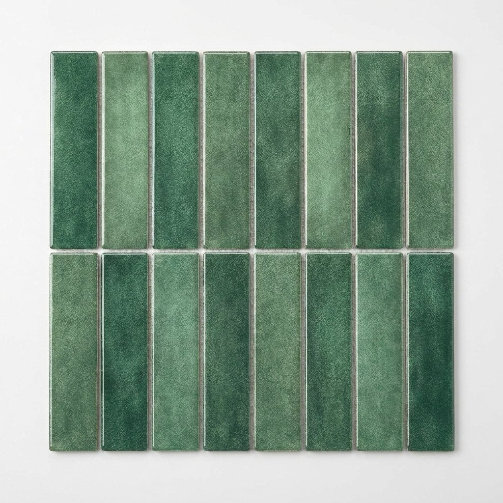 Sheet of forest green glossy subway tile on a plain studio background