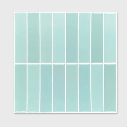 Sheet of pale sky blue glossy subway tile on a plain studio background