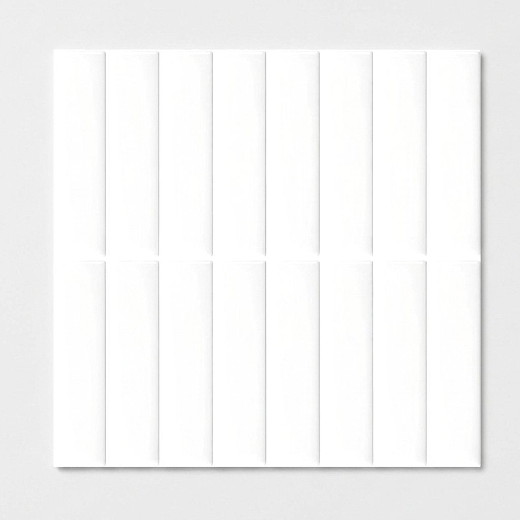 Sheet of white glossy subway tile on a plain studio background