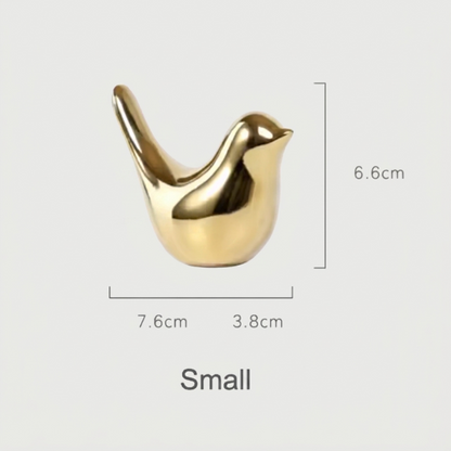 Small gold bird sculpture dimensions graphic on white background