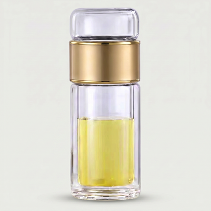Gold loose leaf tea infuser water bottle on white background
