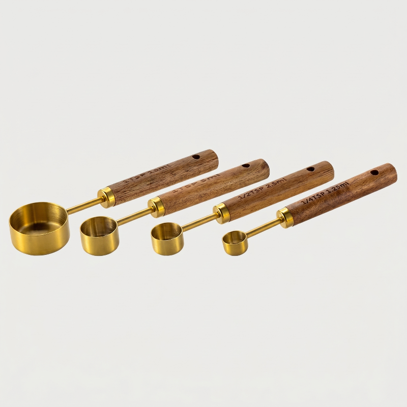 Gold measuring spoons set of 4 on white background