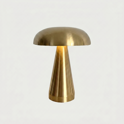 Gold metallic mushroom table lamp on white background