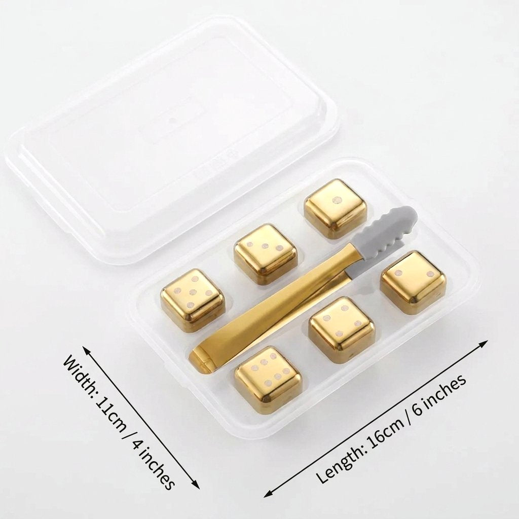 Six gold dice chilling stones in a clear lidded tray with tongs, labeled with a tray width of 11 cm and length of 16 cm