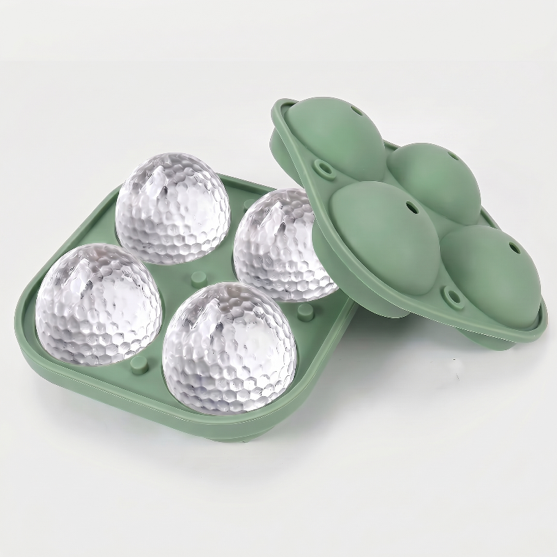 Green golf ball ice mold tray on white background with molded ice balls