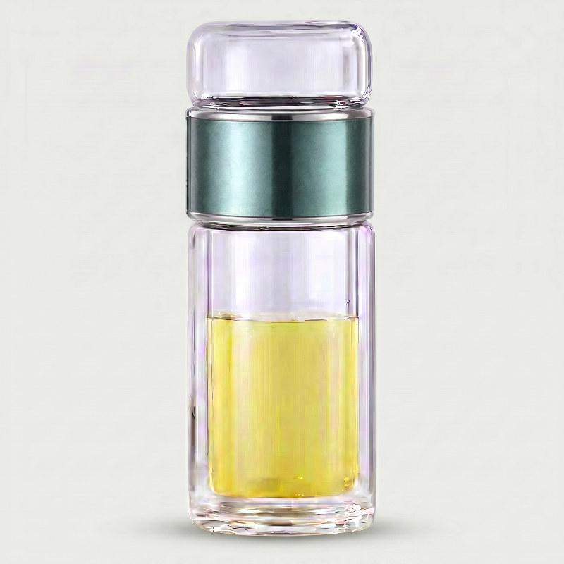 Green loose leaf tea infuser water bottle on white background