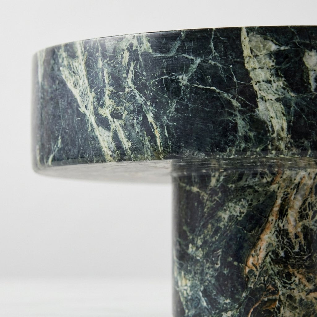 Close-up of the green marble's natural veining and texture on the fruit bowl's surface