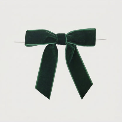Green velvet bow on white background