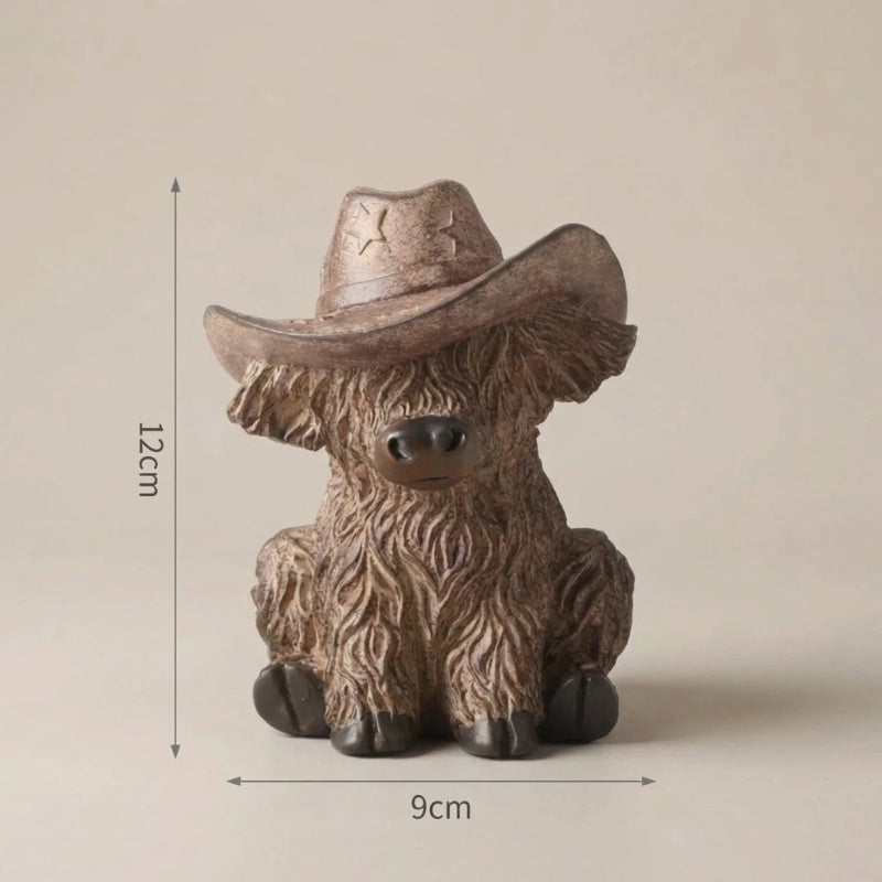 Small figurine of a cow wearing a cowboy hat with dimensions indicated on a beige background