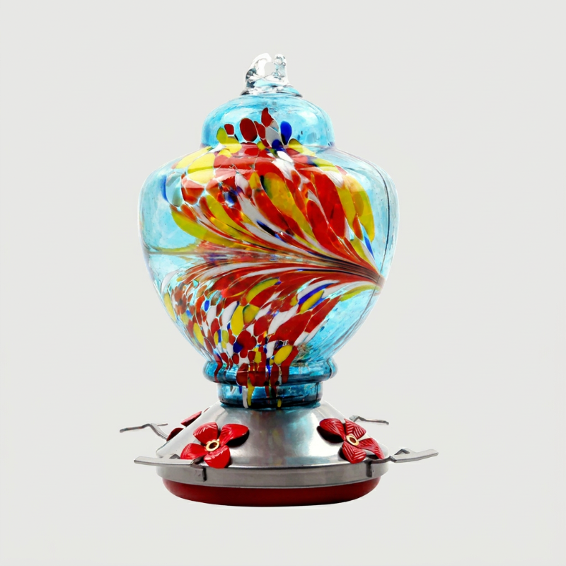 Multicolor handblown glass hummingbird feeder on white background