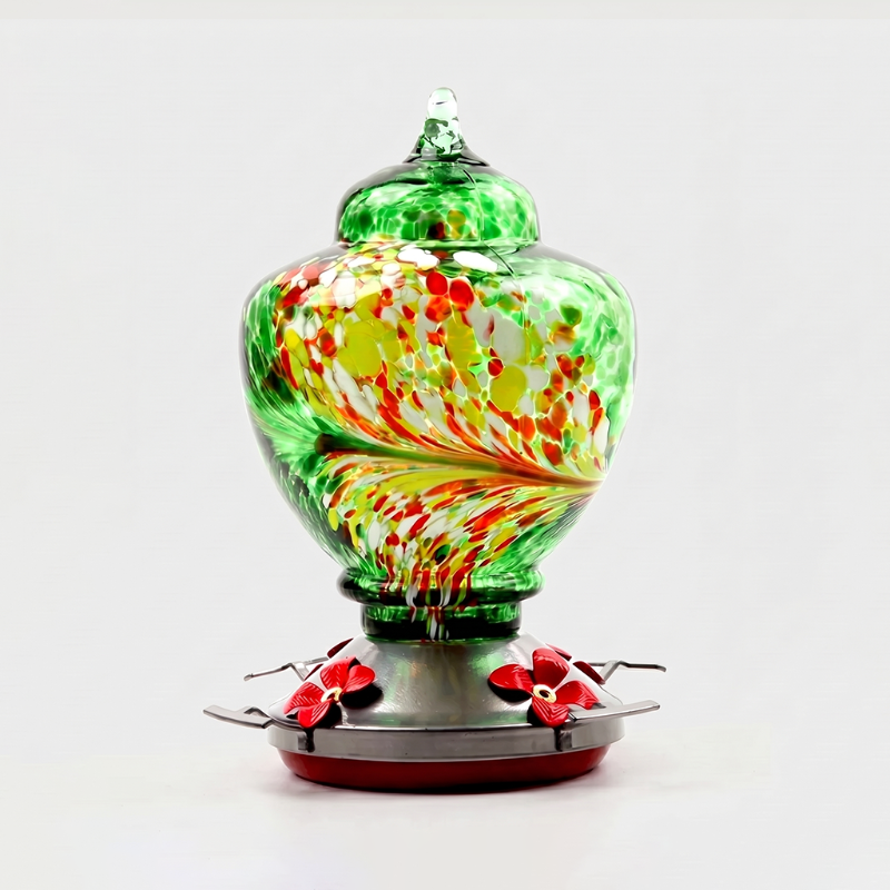 Green handblown glass hummingbird feeder on white background